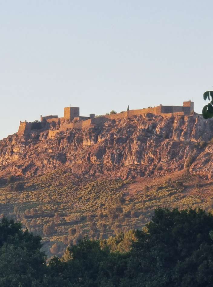 The walled town of Marvão on its ridge, lit gold at the end of the day