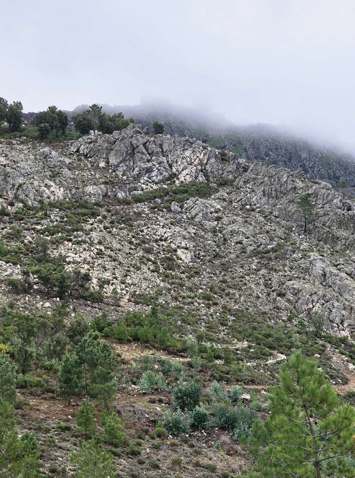 Cloud coming down over the rocky slopes of the Serra de São Mamede